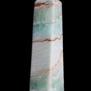 Pistachio Calcite obelisk 155mm 465g in sunlight - Rocks and Things Store