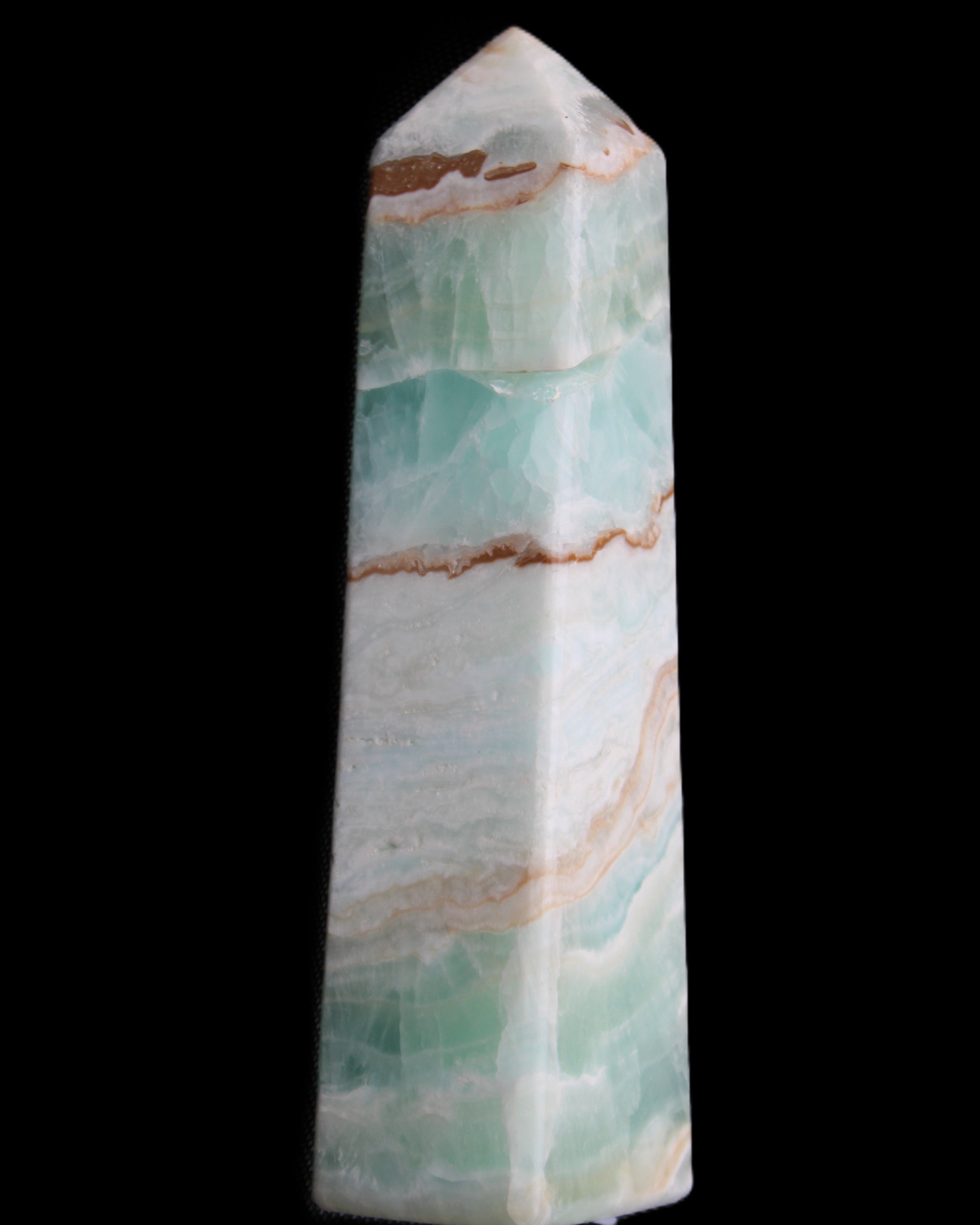 Pistachio Calcite obelisk 155mm 465g in sunlight - Rocks and Things Store