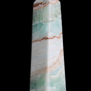 Pistachio Calcite obelisk 155mm 465g in sunlight - Rocks and Things Store
