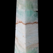 Pistachio Calcite obelisk 155mm 465g in sunlight - Rocks and Things Store