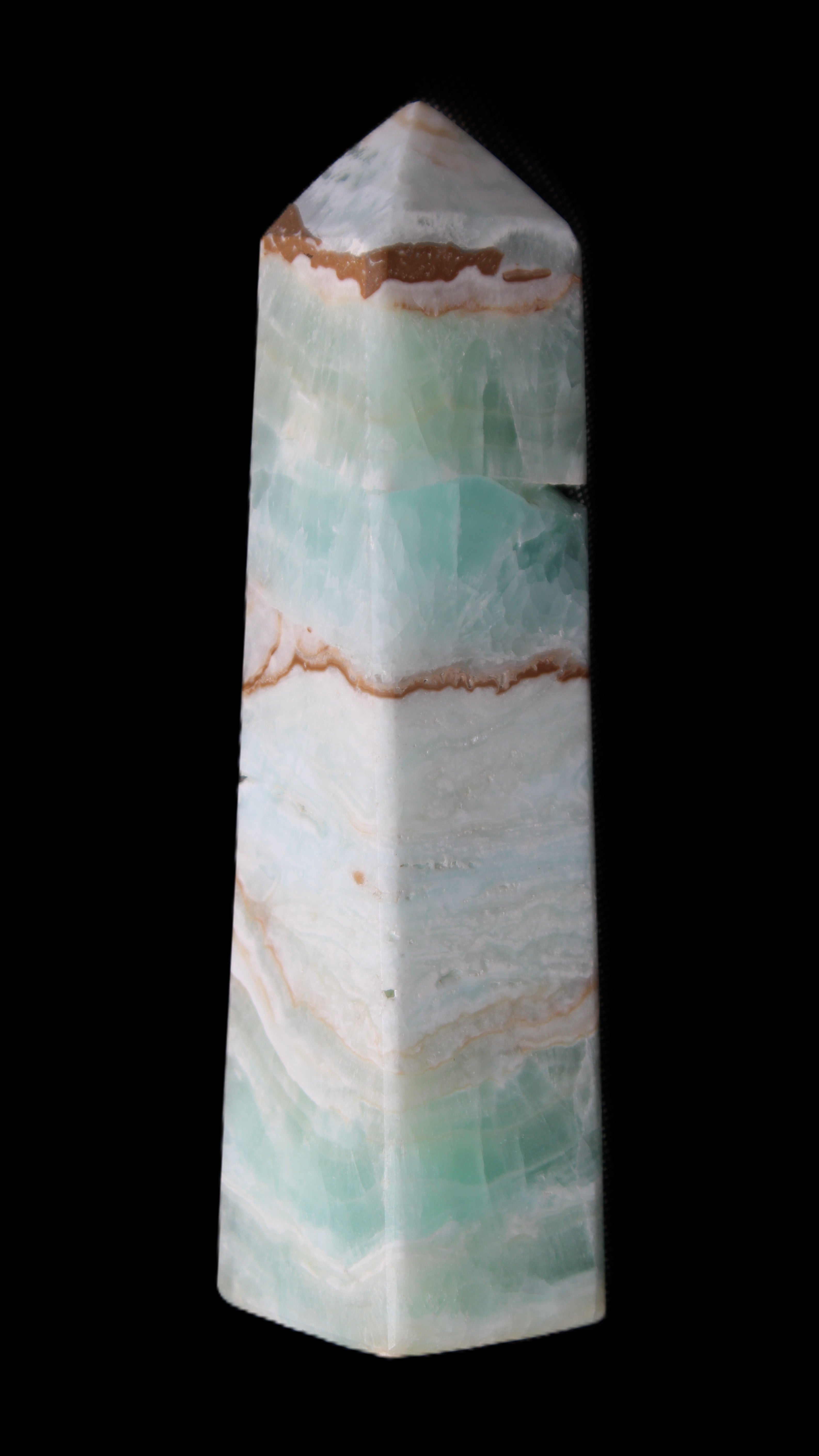 Pistachio Calcite obelisk 155mm 465g in sunlight - Rocks and Things Store