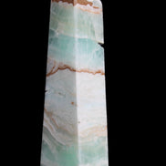 Pistachio Calcite obelisk 155mm 465g in sunlight - Rocks and Things Store