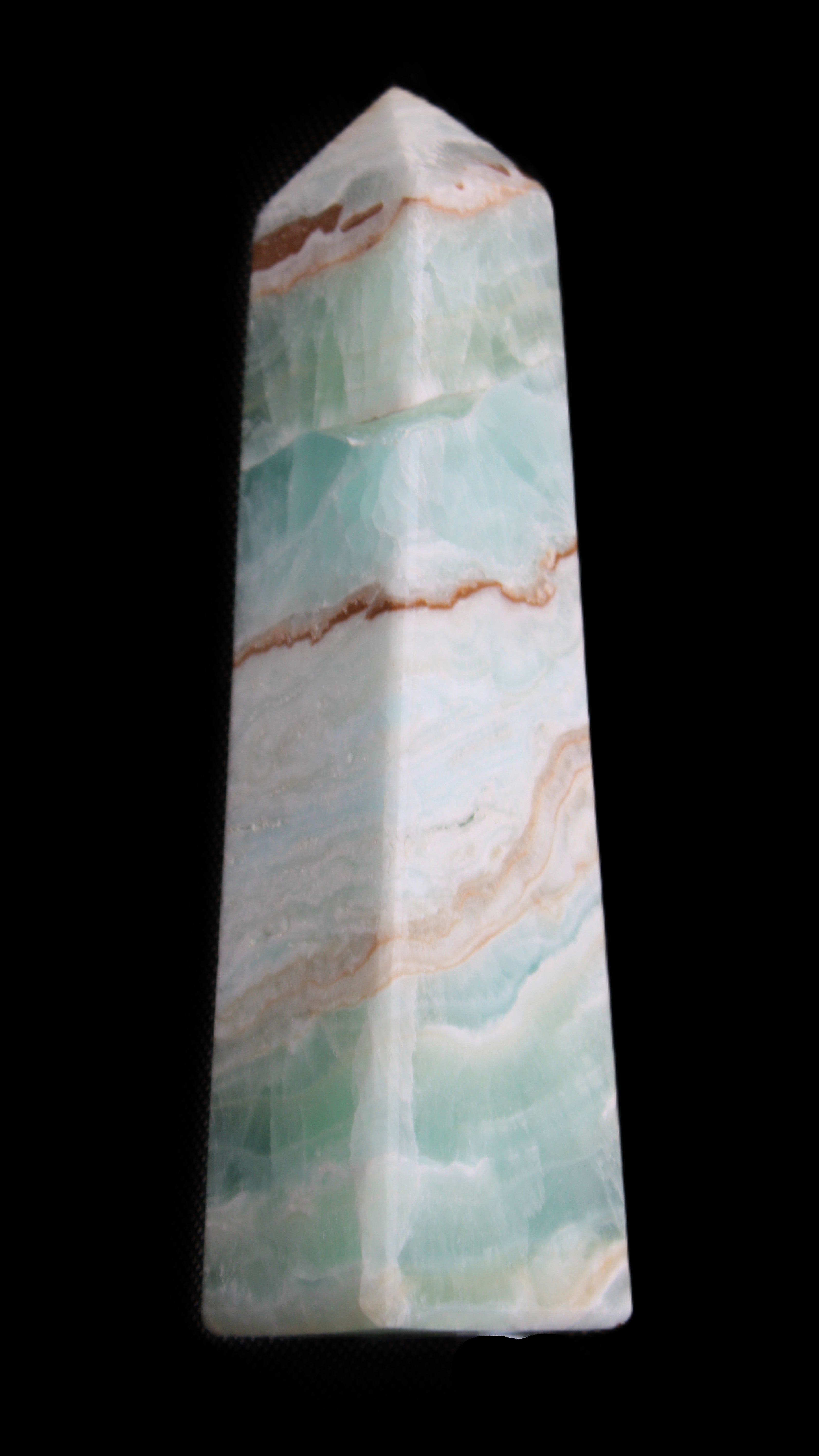 Pistachio Calcite obelisk 155mm 465g in sunlight - Rocks and Things Store