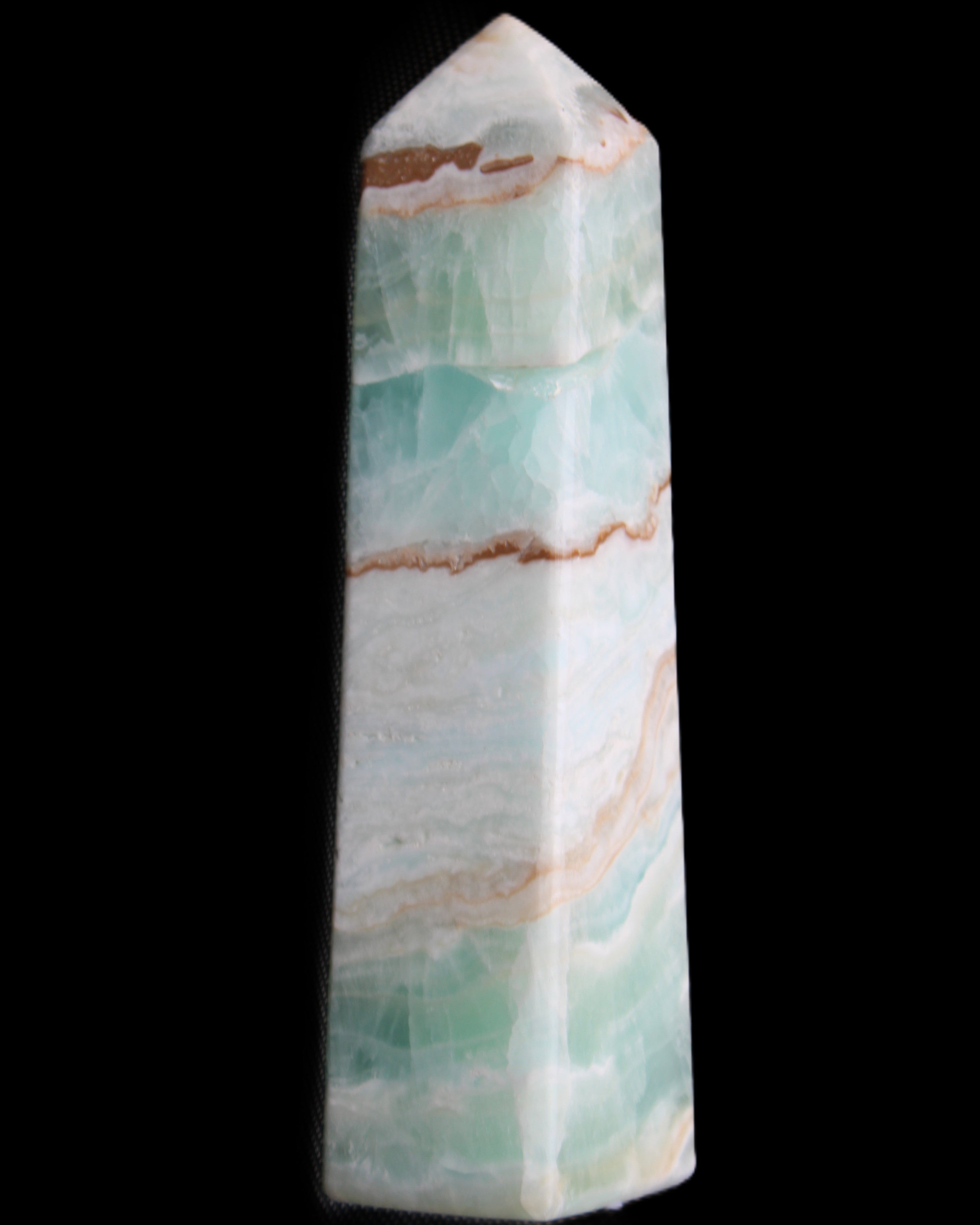 Pistachio Calcite obelisk 155mm 465g in sunlight - Rocks and Things Store