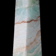 Pistachio Calcite obelisk 155mm 465g in sunlight - Rocks and Things Store