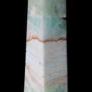 Pistachio Calcite obelisk 155mm 465g in sunlight - Rocks and Things Store