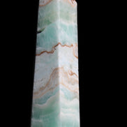 Pistachio Calcite obelisk 155mm 465g in sunlight - Rocks and Things Store