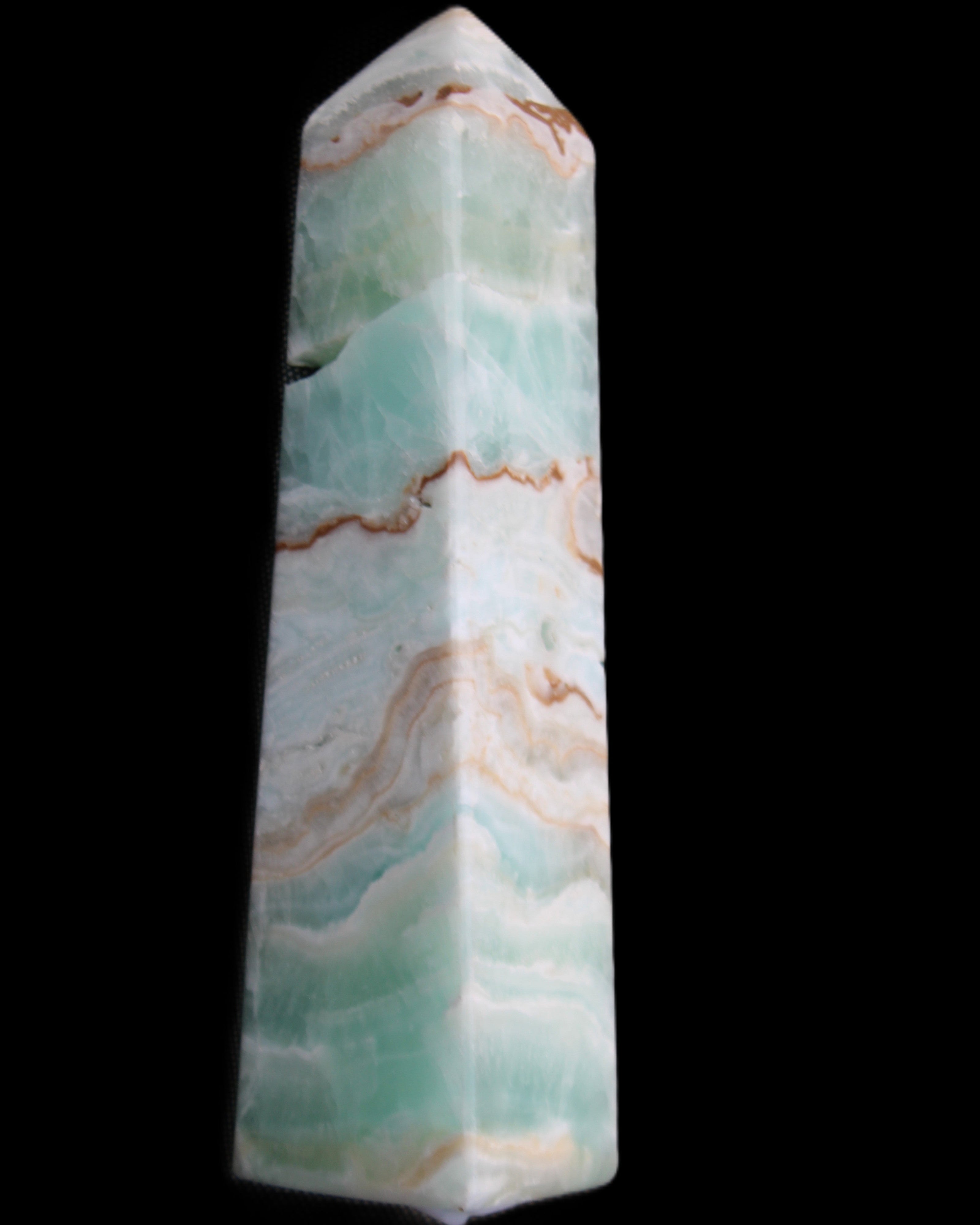 Pistachio Calcite obelisk 155mm 465g in sunlight - Rocks and Things Store