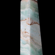 Pistachio Calcite obelisk 155mm 465g in sunlight - Rocks and Things Store