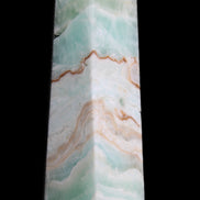Pistachio Calcite obelisk 155mm 465g in sunlight - Rocks and Things Store