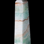 Pistachio Calcite obelisk 155mm 465g in sunlight - Rocks and Things Store
