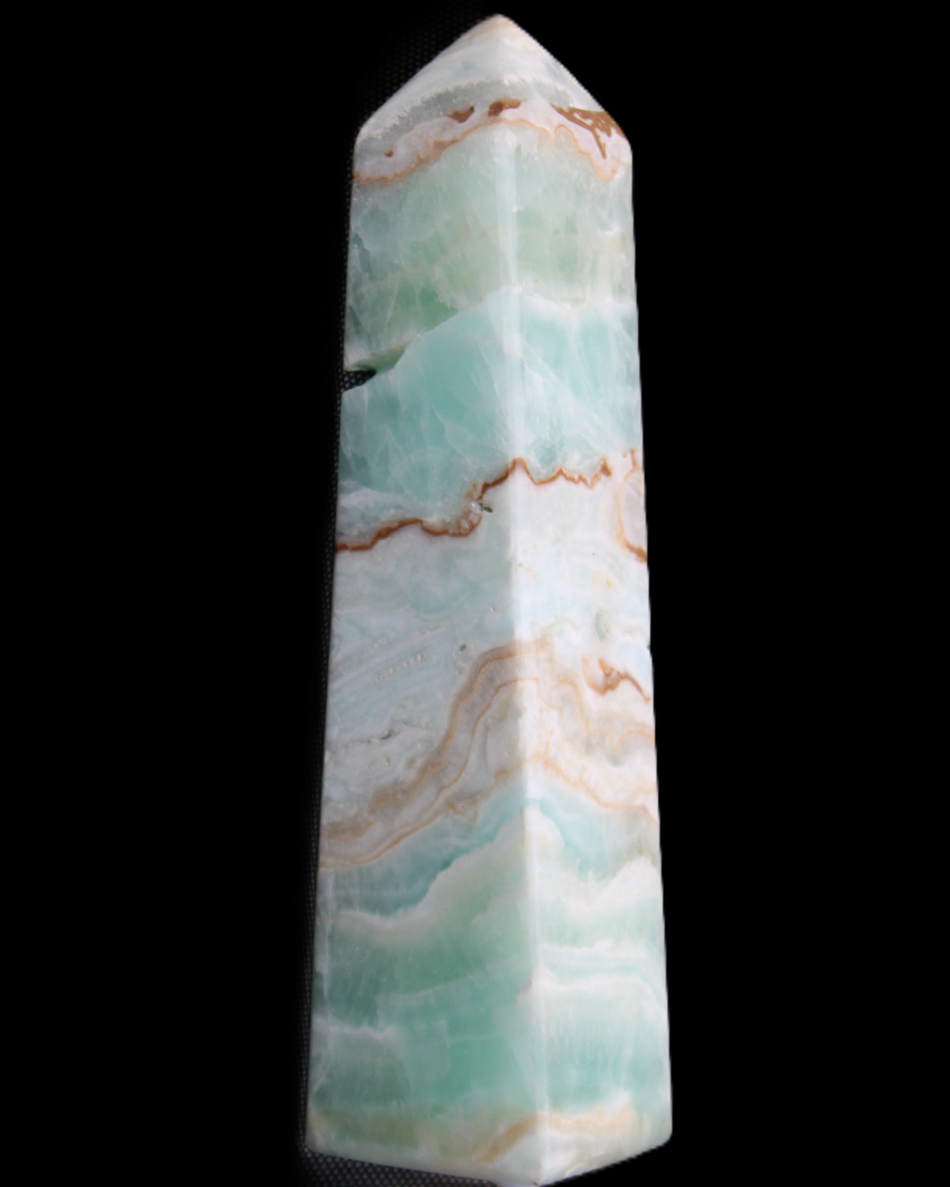 Pistachio Calcite obelisk 155mm 465g in sunlight - Rocks and Things Store