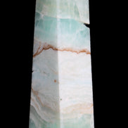 Pistachio Calcite obelisk 155mm 465g in sunlight - Rocks and Things Store