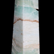 Pistachio Calcite obelisk 155mm 465g in sunlight - Rocks and Things Store