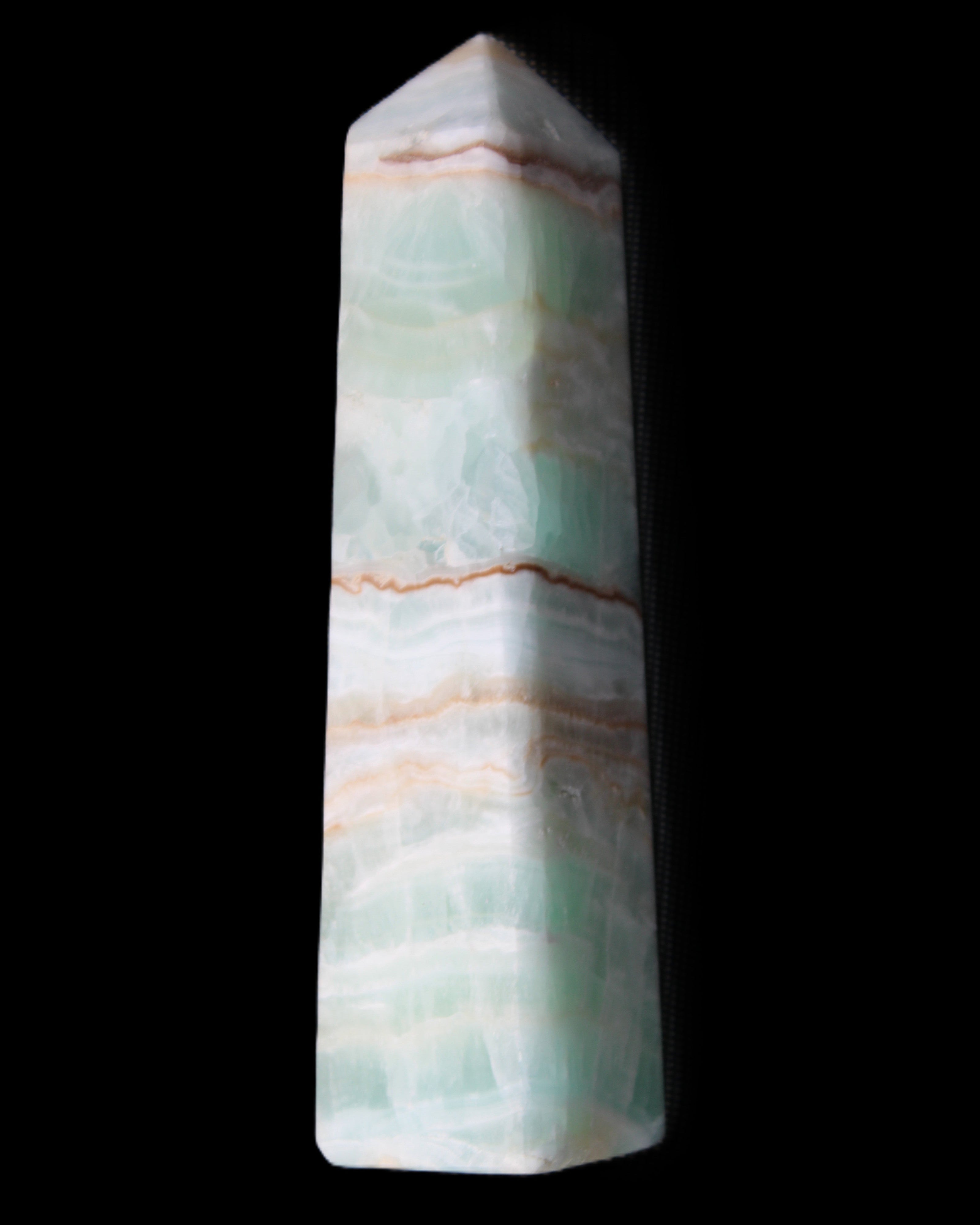 Pistachio Calcite obelisk 140mm 362g in sunlight - Rocks and Things Store