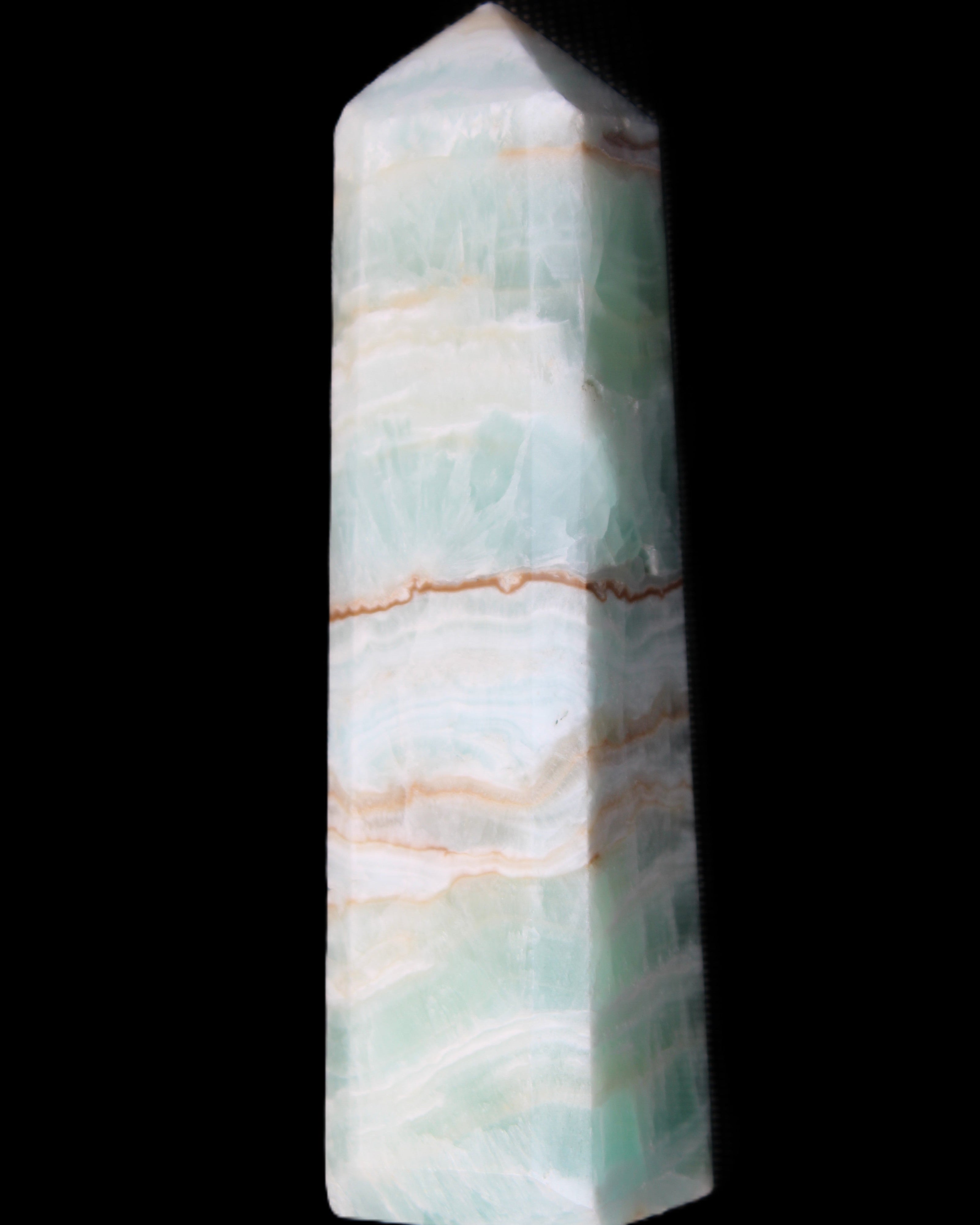 Pistachio Calcite obelisk 140mm 362g in sunlight - Rocks and Things Store