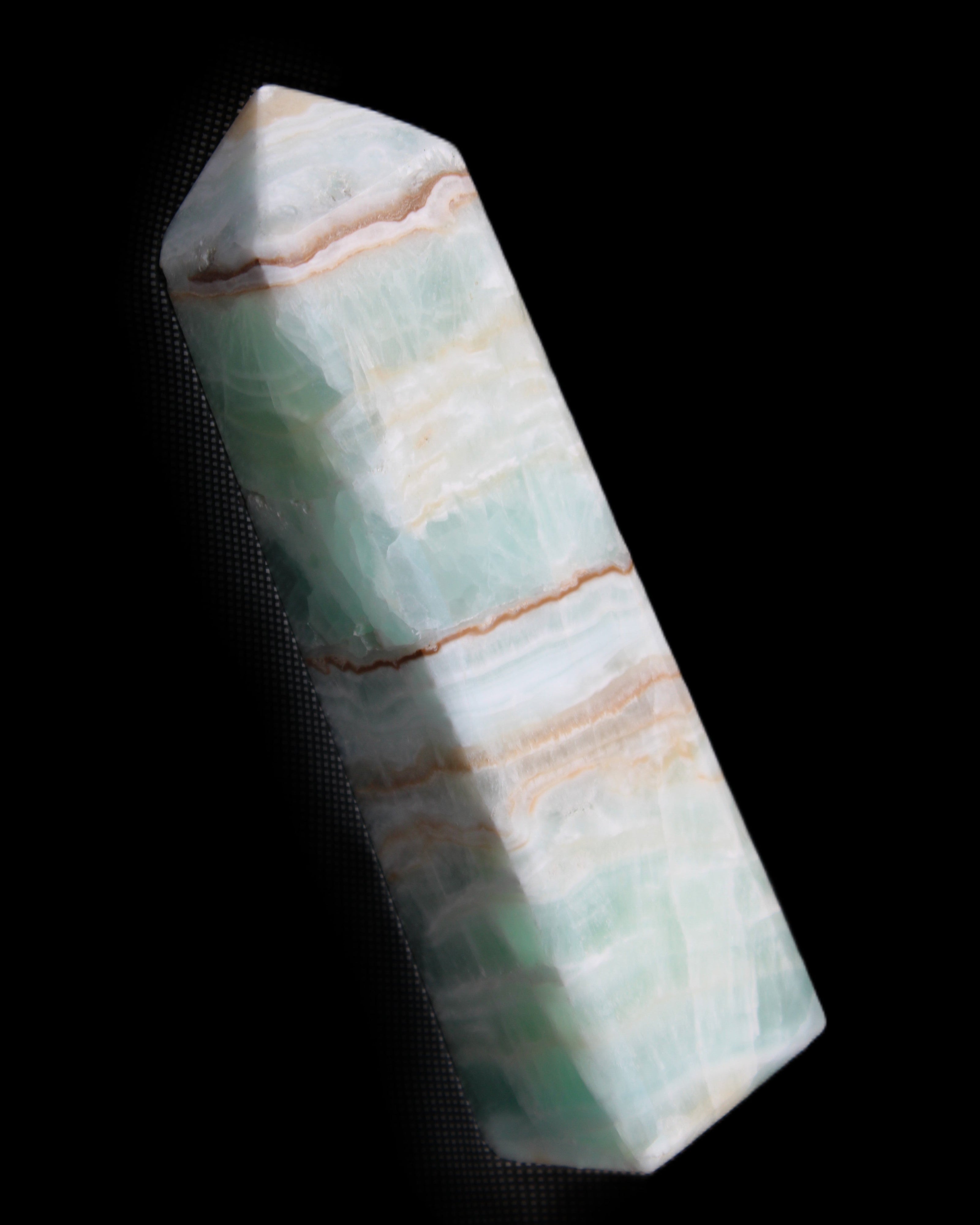 Pistachio Calcite obelisk 140mm 362g in sunlight - Rocks and Things Store