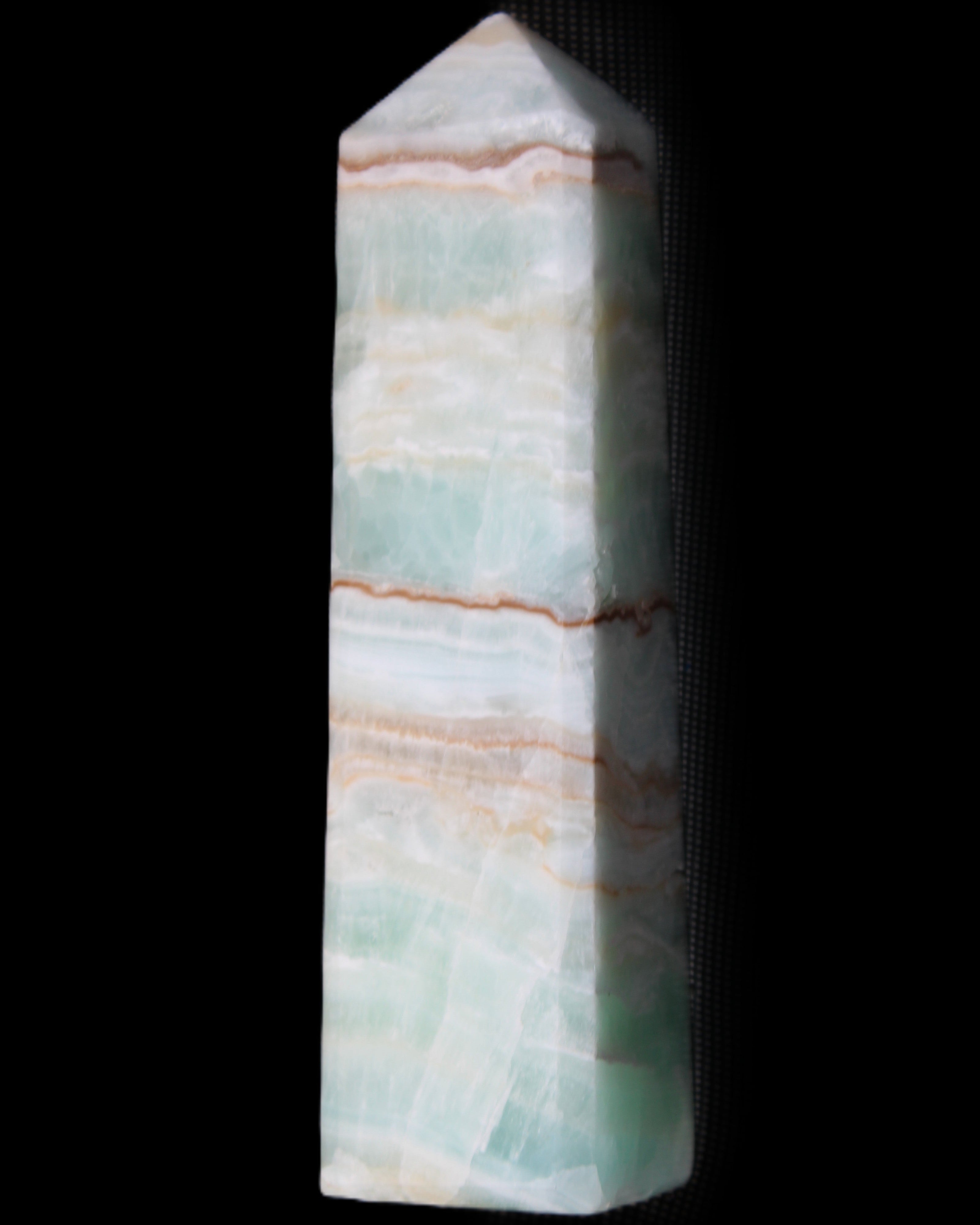 Pistachio Calcite obelisk 140mm 362g in sunlight - Rocks and Things Store