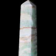 Pistachio Calcite obelisk 140mm 362g in sunlight - Rocks and Things Store