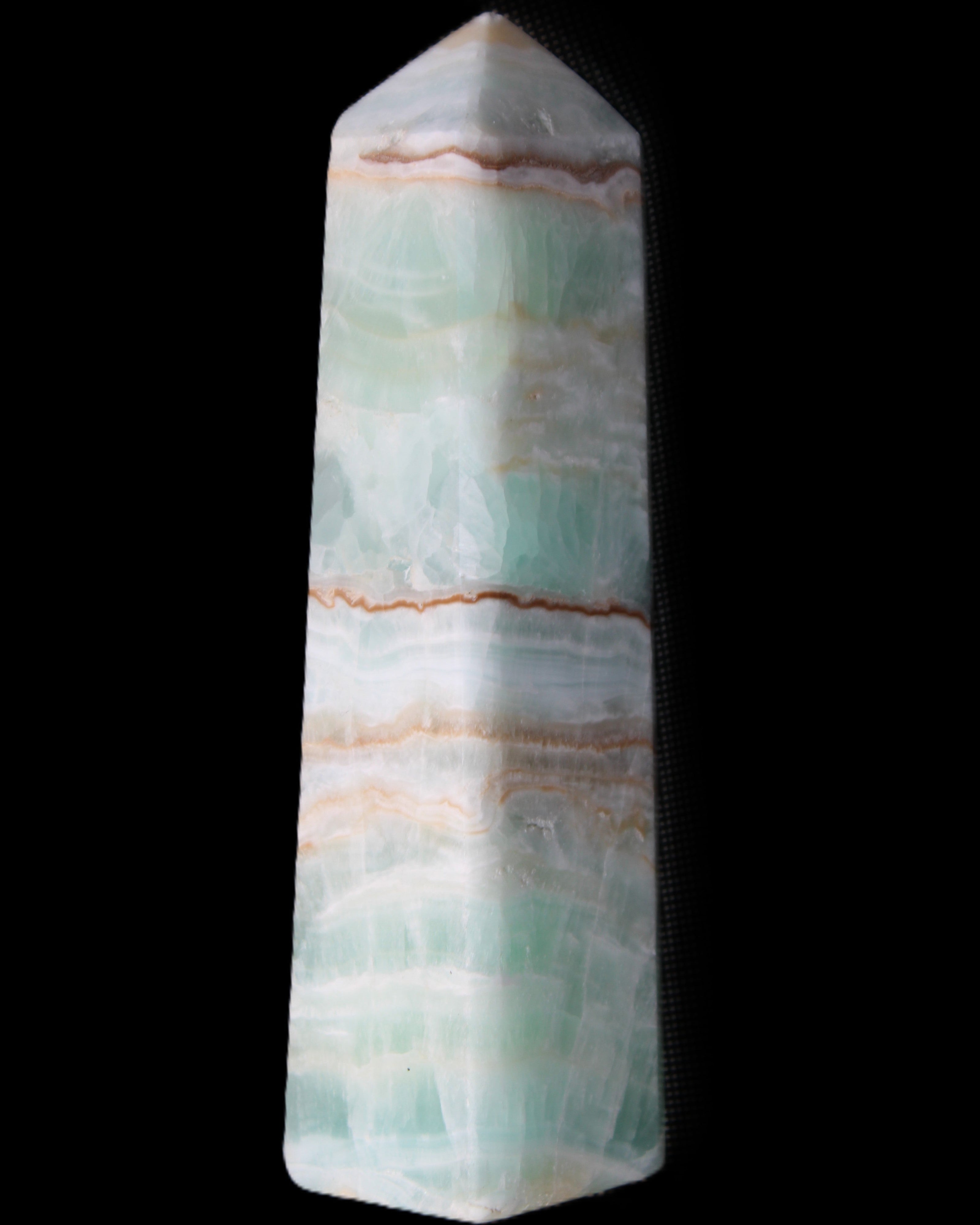Pistachio Calcite obelisk 140mm 362g in sunlight - Rocks and Things Store