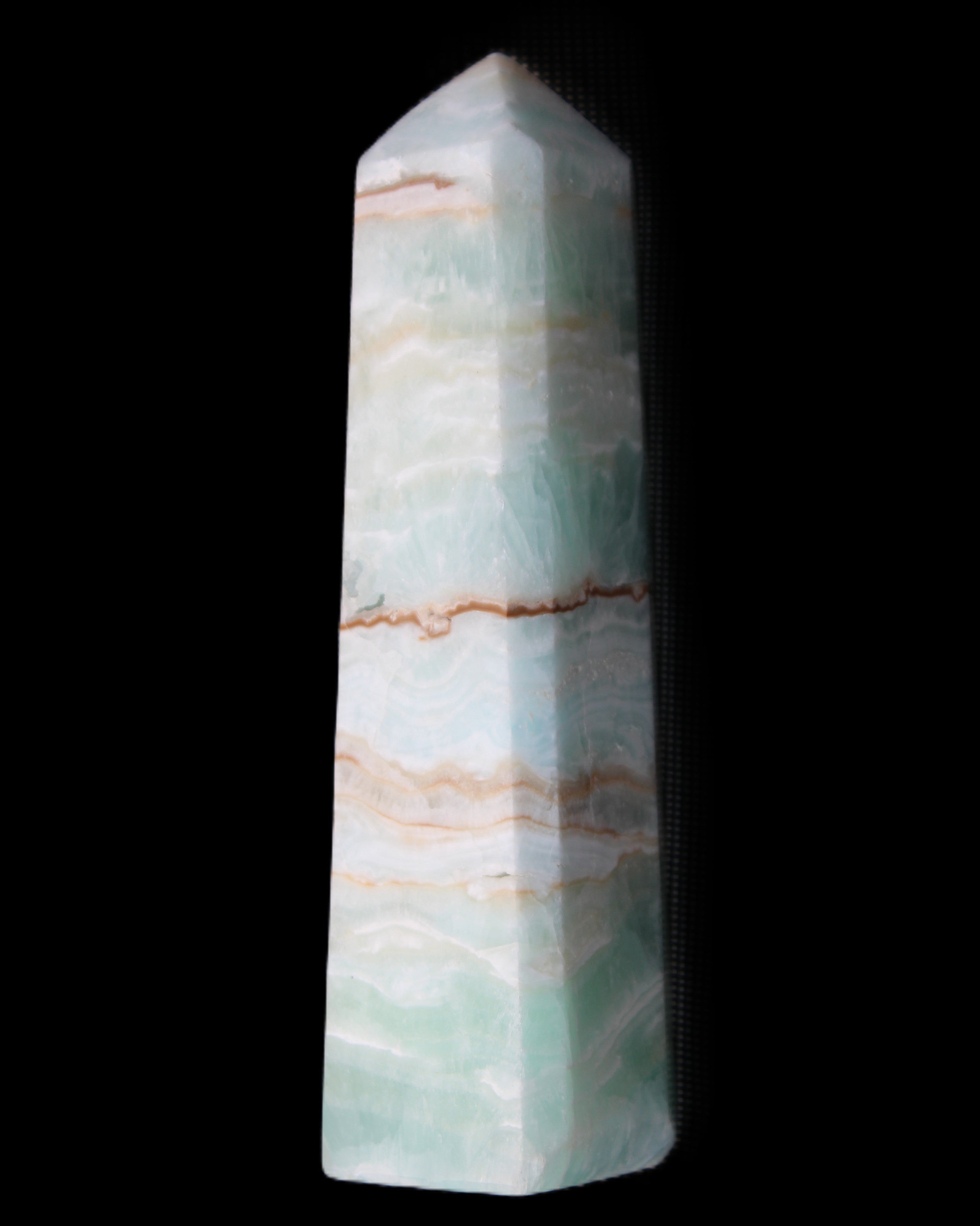 Pistachio Calcite obelisk 140mm 362g in sunlight - Rocks and Things Store