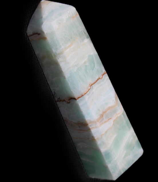 Pistachio Calcite obelisk 140mm 362g in sunlight - Rocks and Things Store