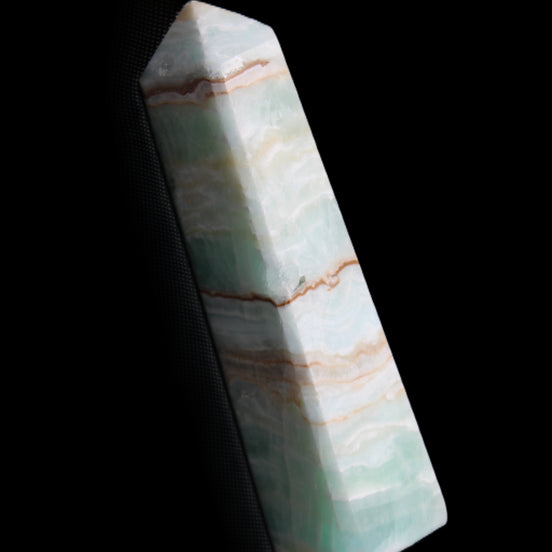 Pistachio Calcite obelisk 140mm 362g in sunlight - Rocks and Things Store