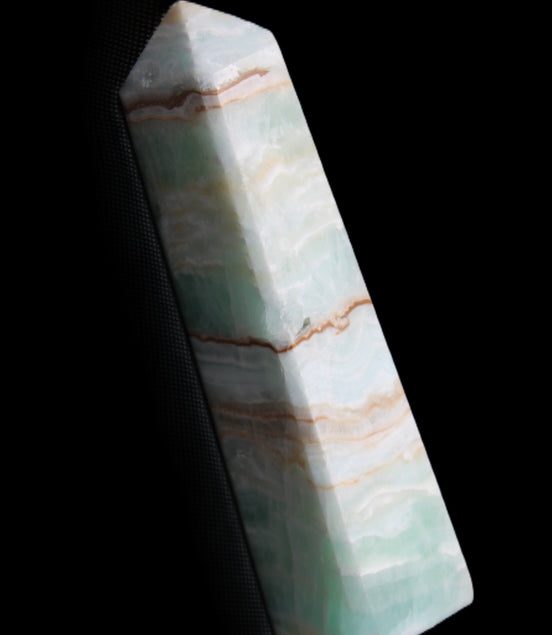 Pistachio Calcite obelisk 140mm 362g in sunlight - Rocks and Things Store