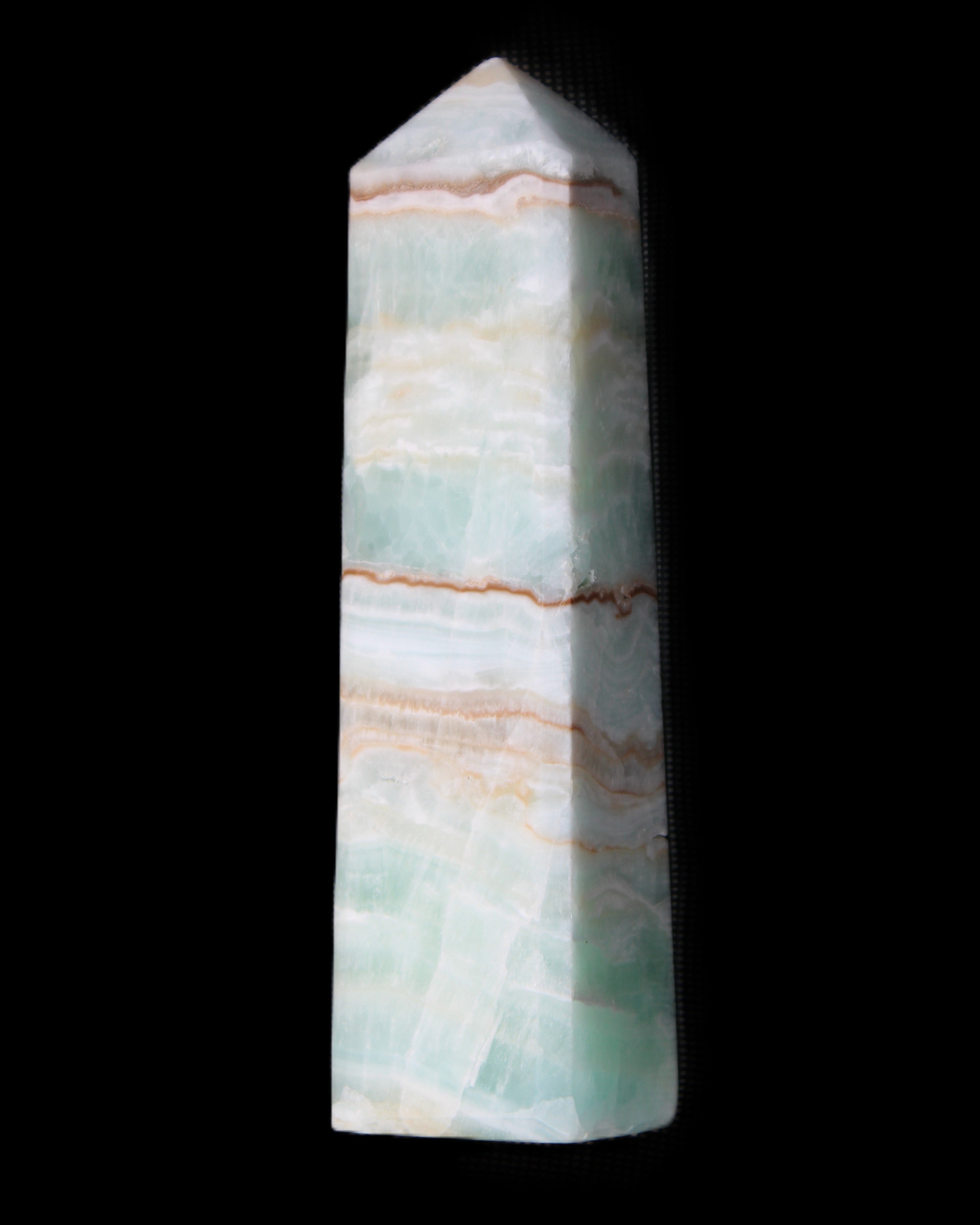 Pistachio Calcite obelisk 140mm 362g in sunlight - Rocks and Things Store