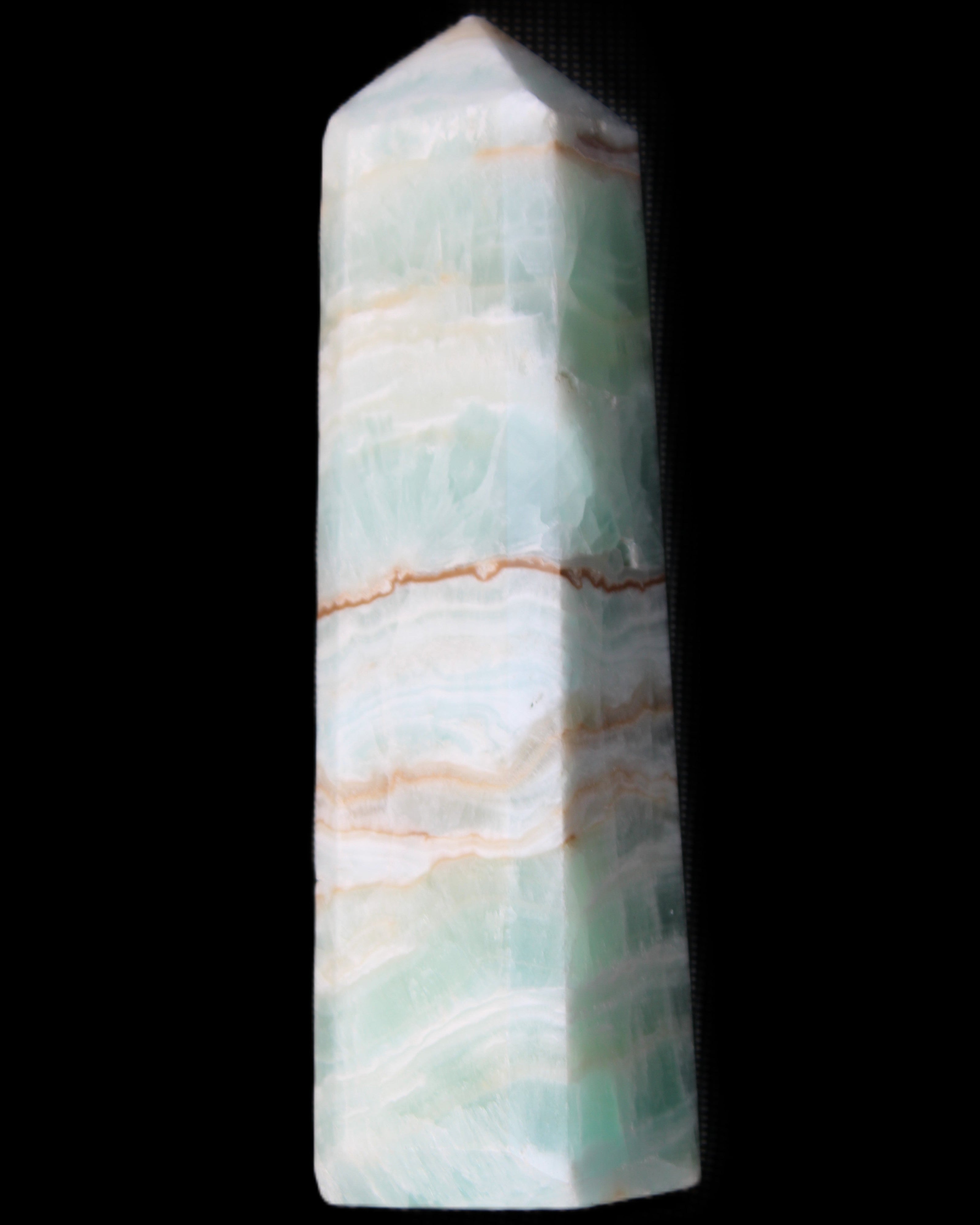 Pistachio Calcite obelisk 140mm 362g in sunlight - Rocks and Things Store