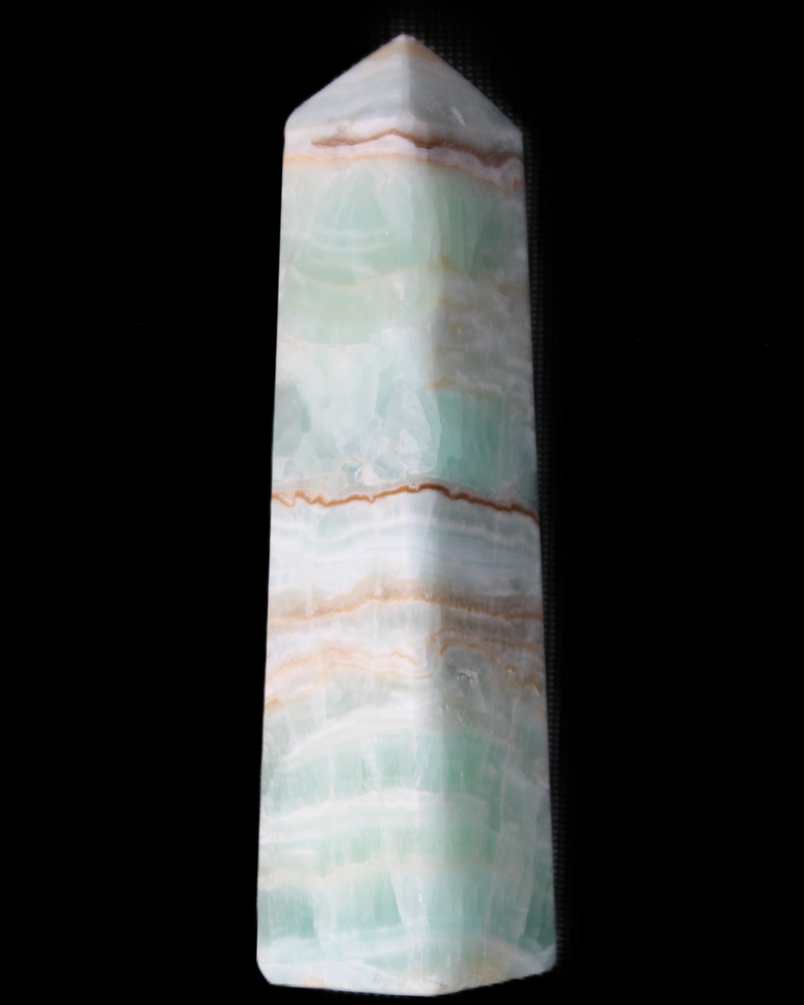 Pistachio Calcite obelisk 140mm 362g in sunlight - Rocks and Things Store