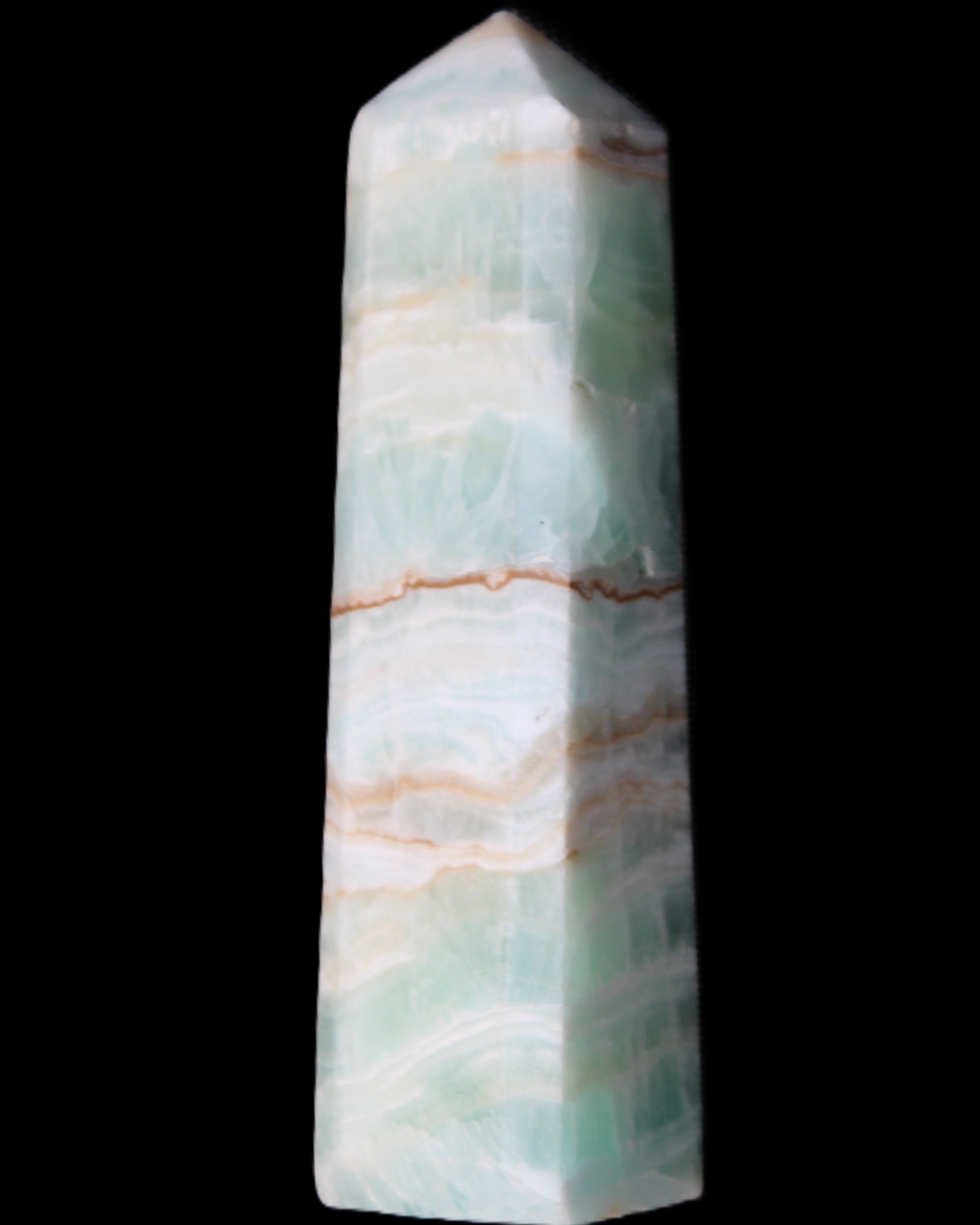Pistachio Calcite obelisk 140mm 362g in sunlight - Rocks and Things Store