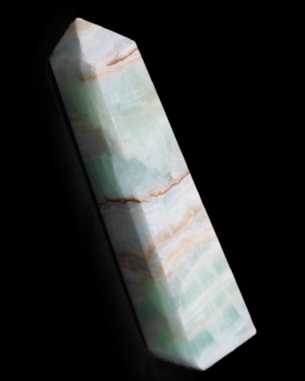 Pistachio Calcite obelisk 140mm 362g in sunlight - Rocks and Things Store