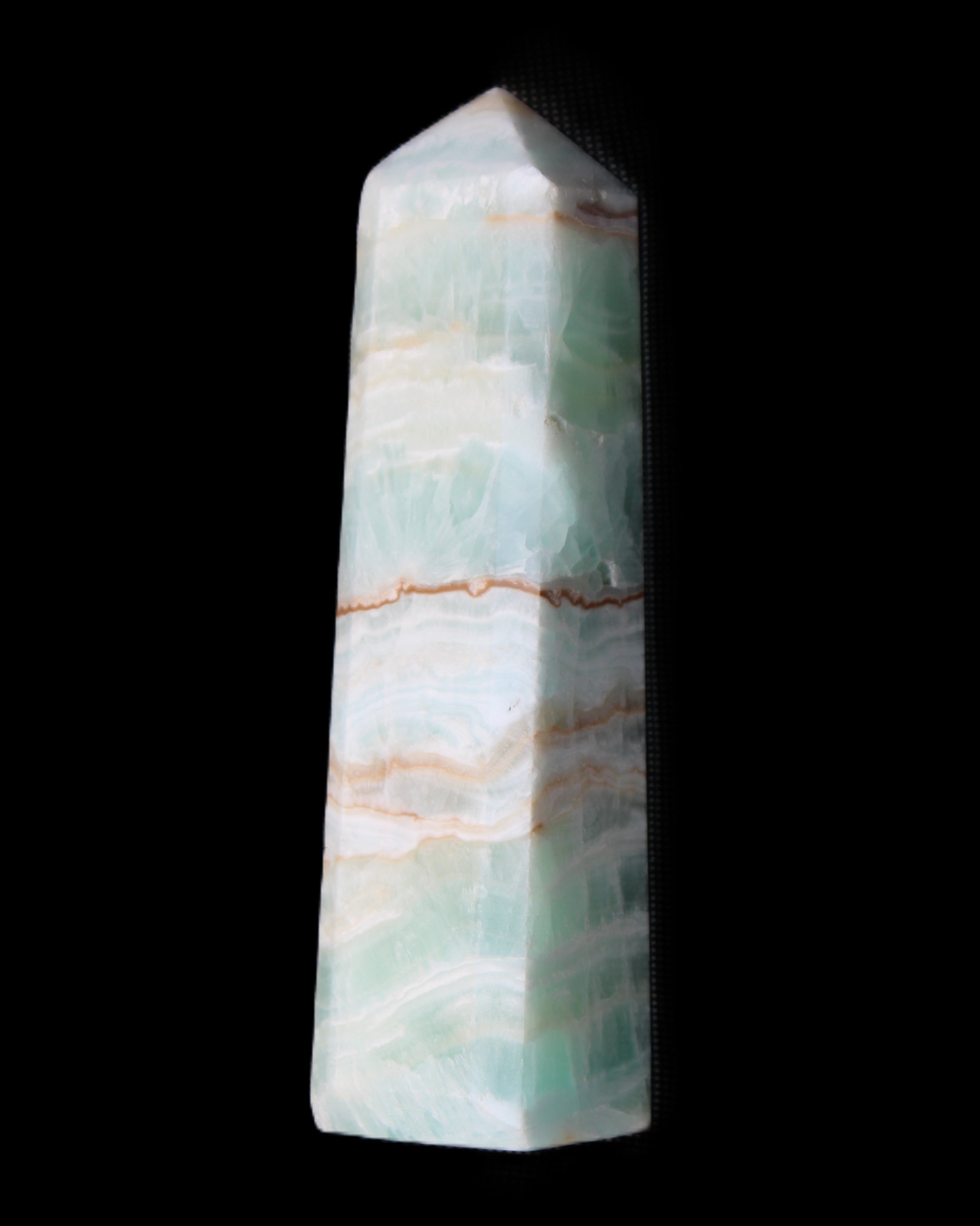 Pistachio Calcite obelisk 140mm 362g in sunlight - Rocks and Things Store