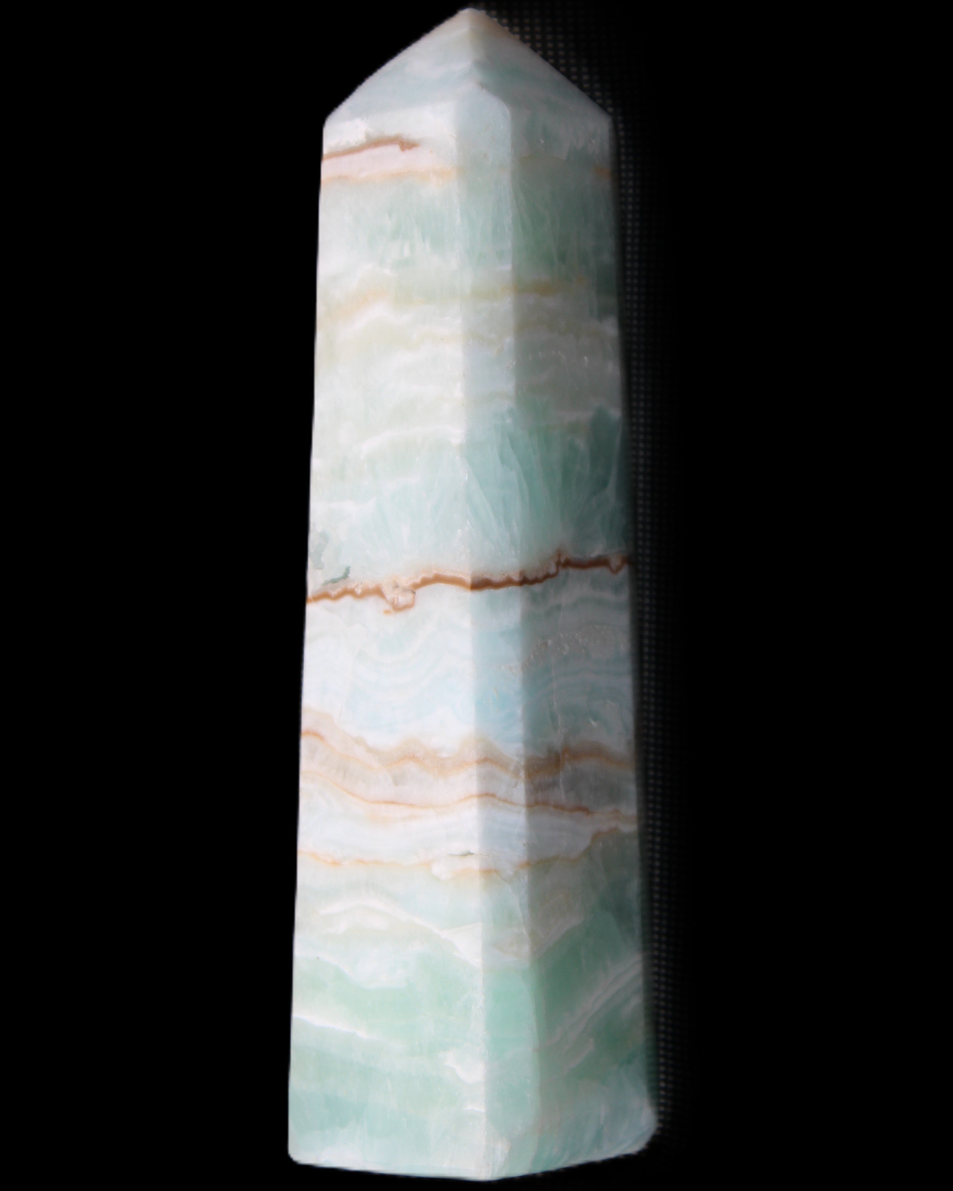 Pistachio Calcite obelisk 140mm 362g in sunlight - Rocks and Things Store