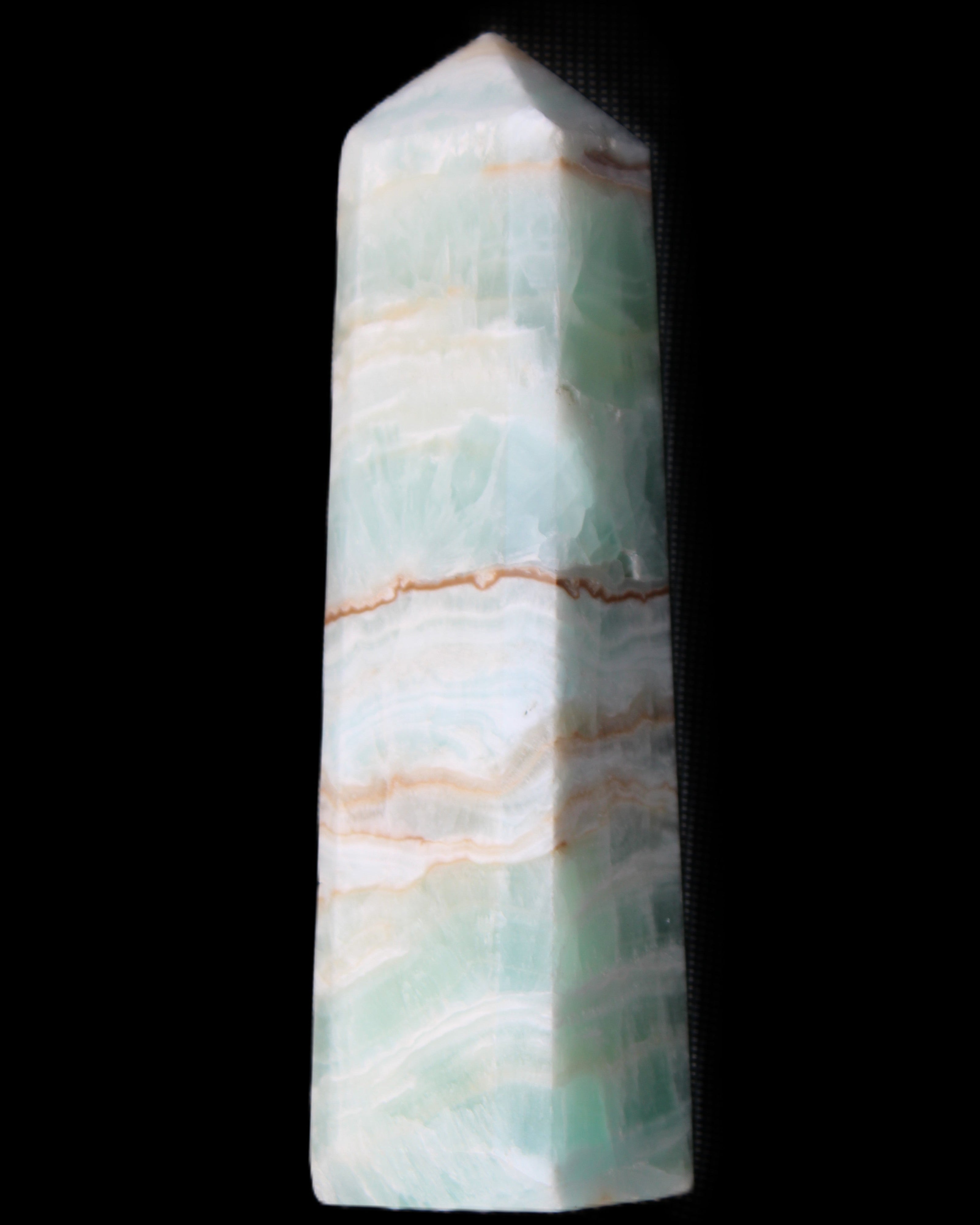 Pistachio Calcite obelisk 140mm 362g in sunlight - Rocks and Things Store