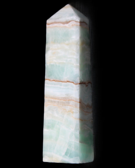 Pistachio Calcite obelisk 140mm 362g in sunlight - Rocks and Things Store