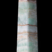 Pistachio Calcite obelisk 140mm 362g in sunlight - Rocks and Things Store