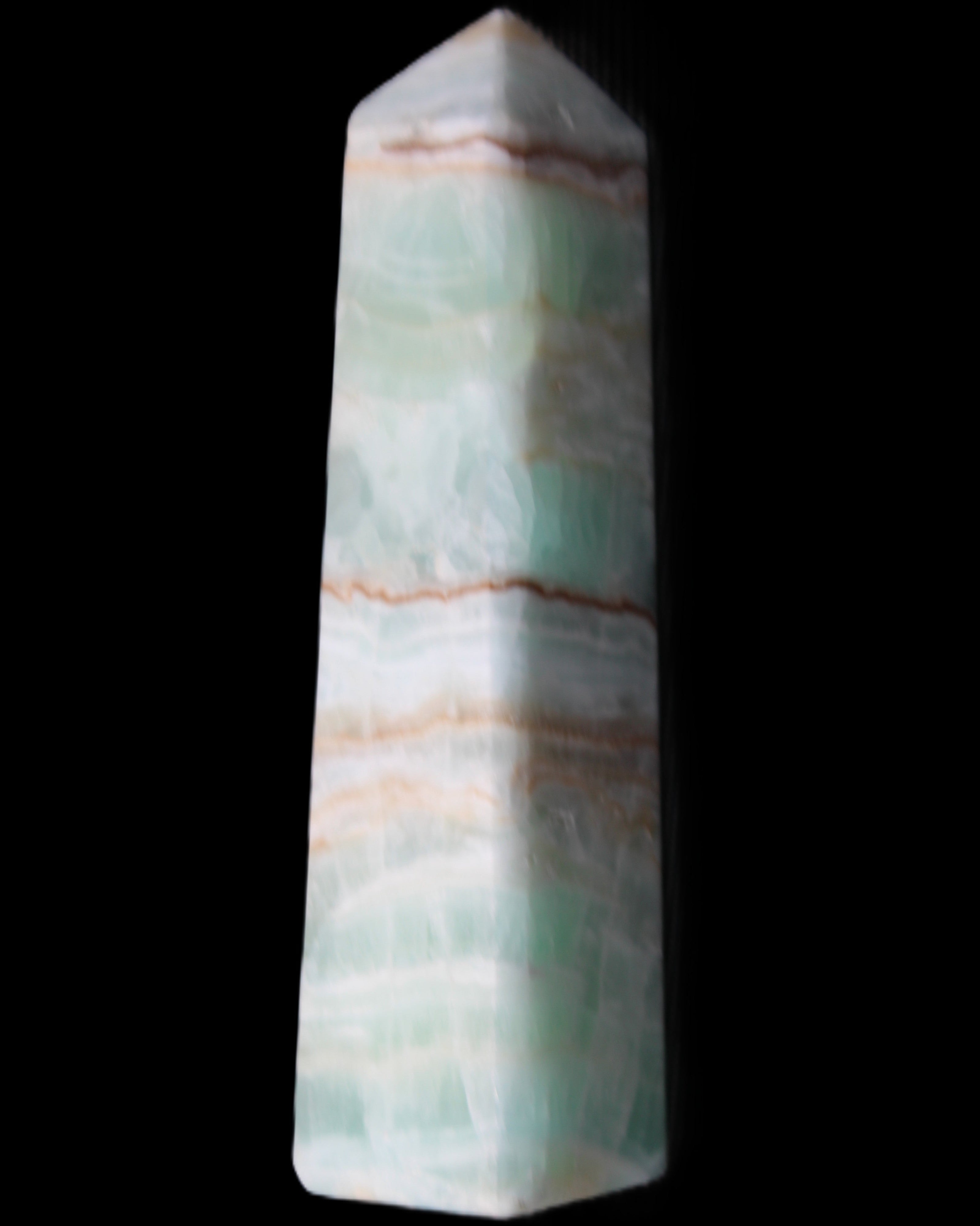Pistachio Calcite obelisk 140mm 362g in sunlight - Rocks and Things Store