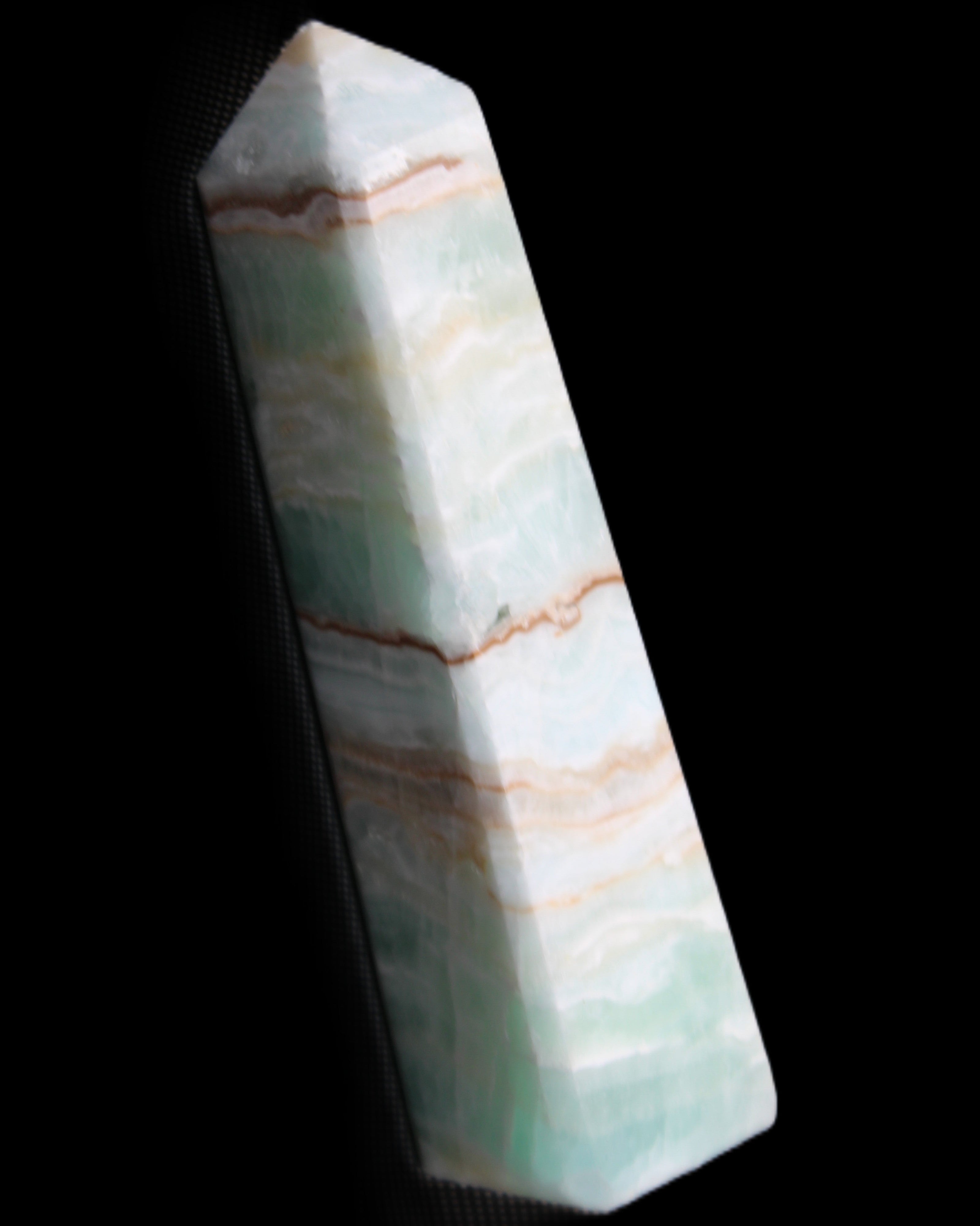 Pistachio Calcite obelisk 140mm 362g in sunlight - Rocks and Things Store