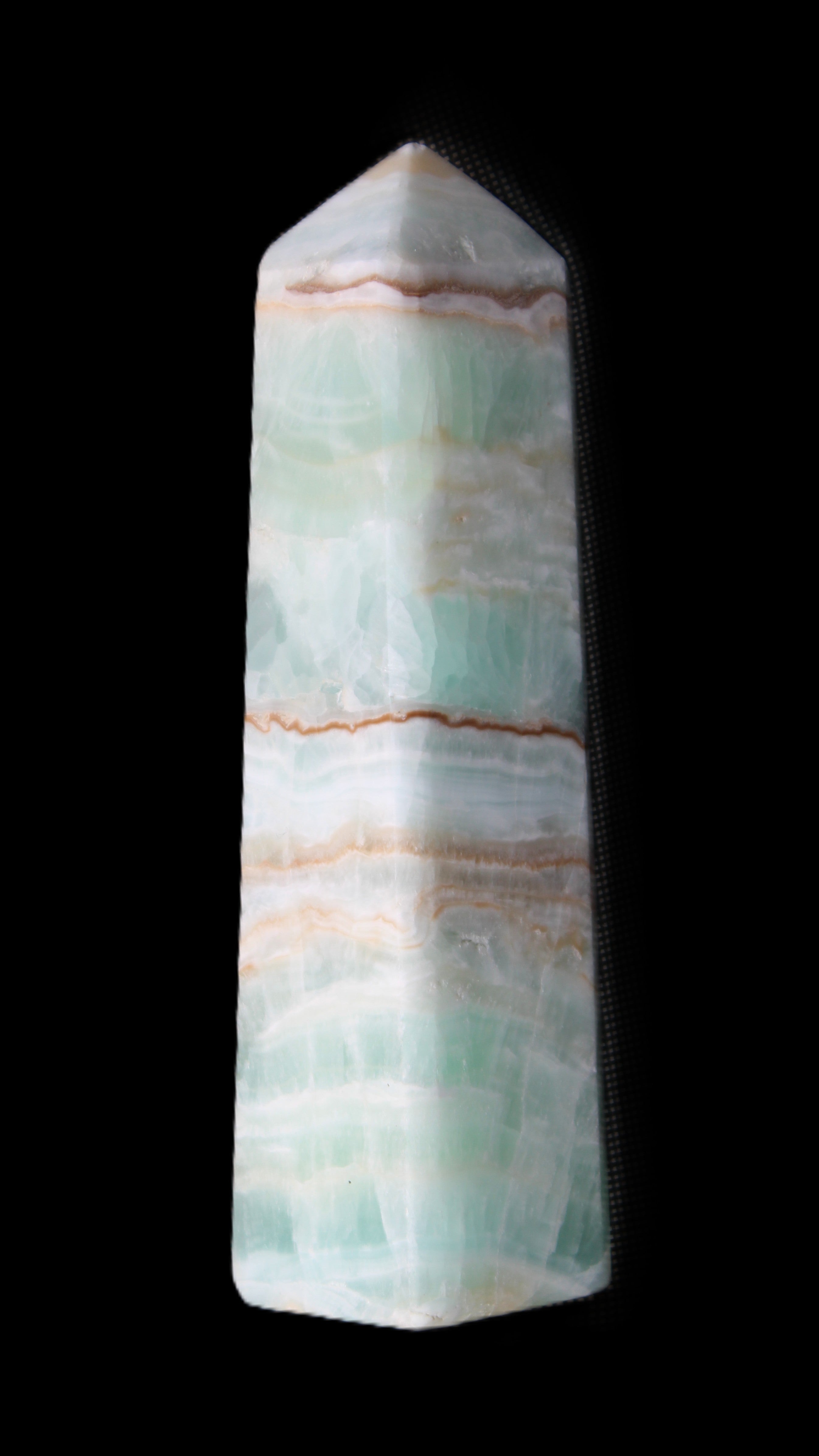 Pistachio Calcite obelisk 140mm 362g in sunlight - Rocks and Things Store