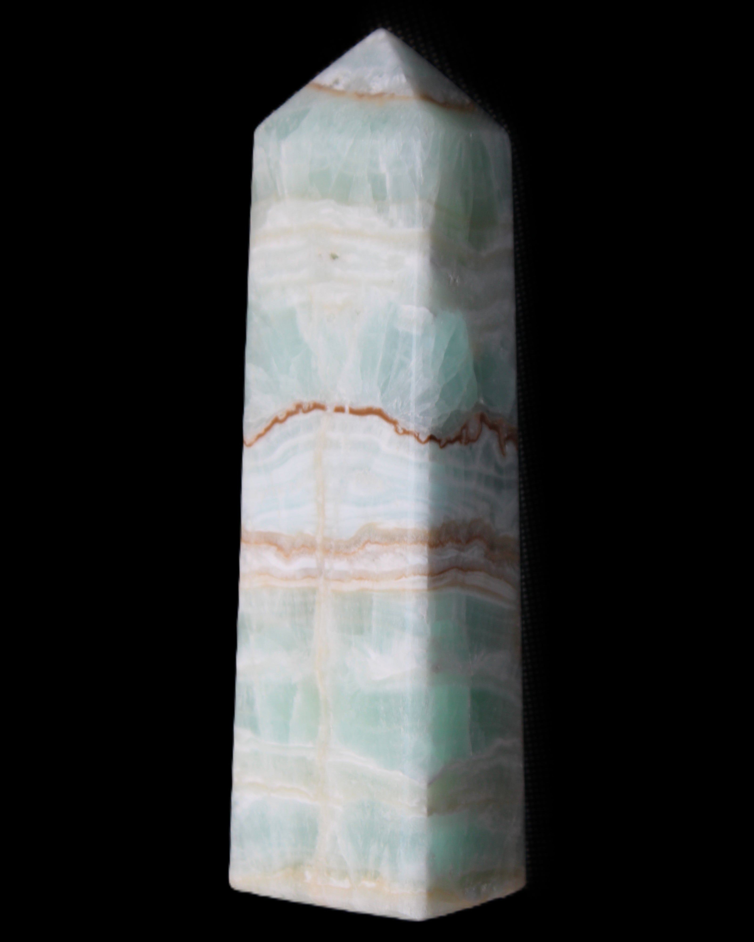 Pistachio Calcite obelisk 134mm 346g in sunlight - Rocks and Things Store