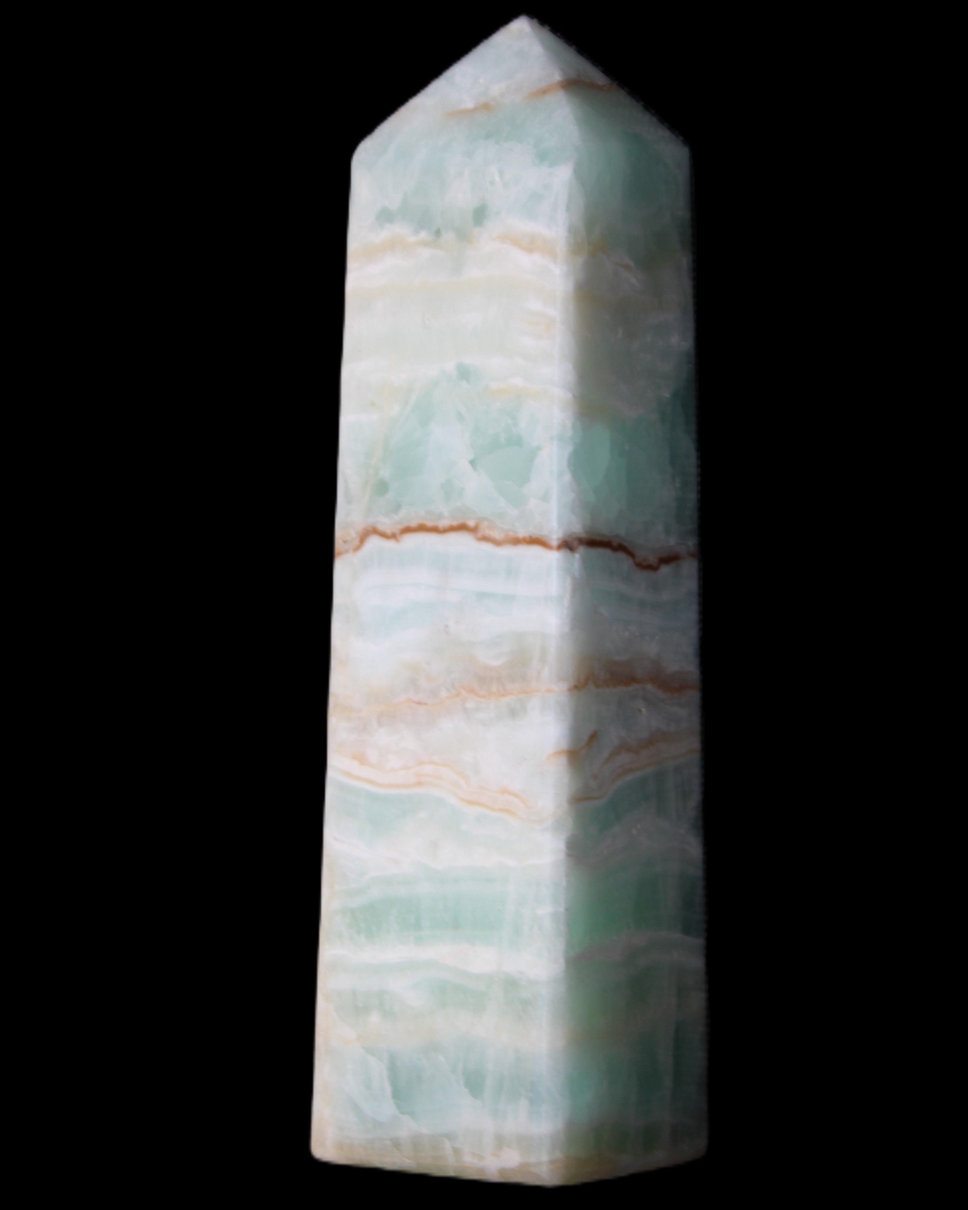 Pistachio Calcite obelisk 134mm 346g in sunlight - Rocks and Things Store