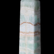 Pistachio Calcite obelisk 134mm 346g in sunlight - Rocks and Things Store