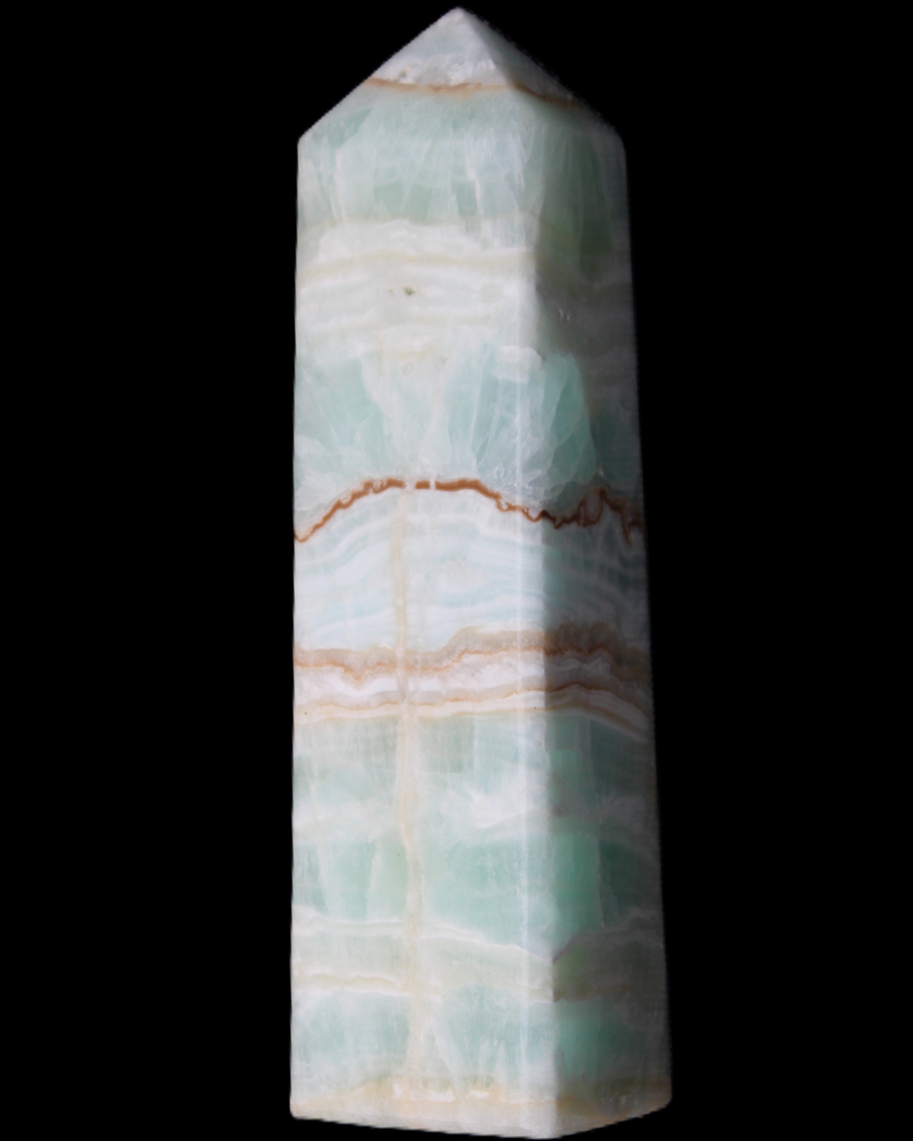 Pistachio Calcite obelisk 134mm 346g in sunlight - Rocks and Things Store