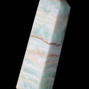Pistachio Calcite obelisk 134mm 346g in sunlight - Rocks and Things Store