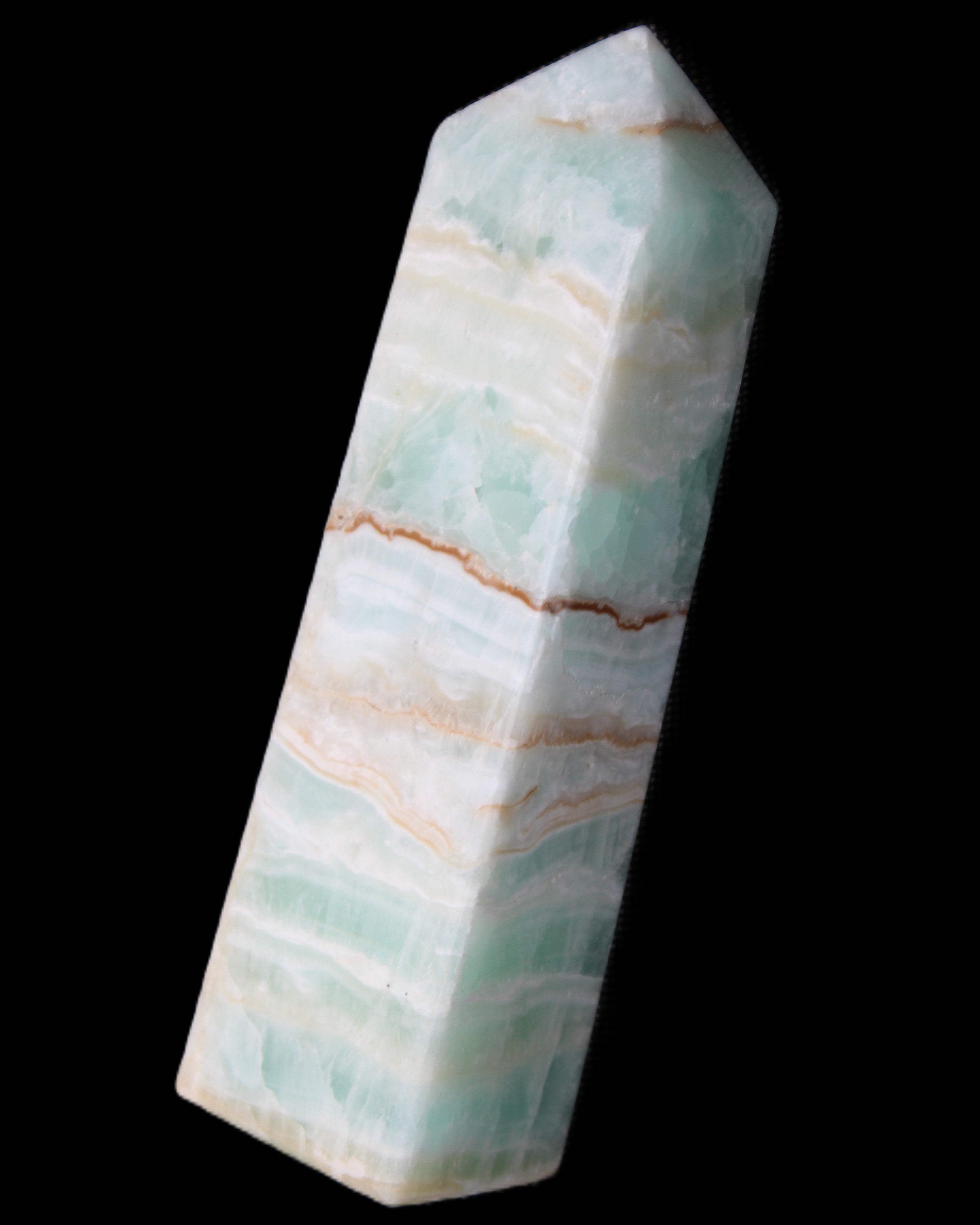 Pistachio Calcite obelisk 134mm 346g in sunlight - Rocks and Things Store