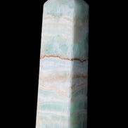 Pistachio Calcite obelisk 134mm 346g in sunlight - Rocks and Things Store
