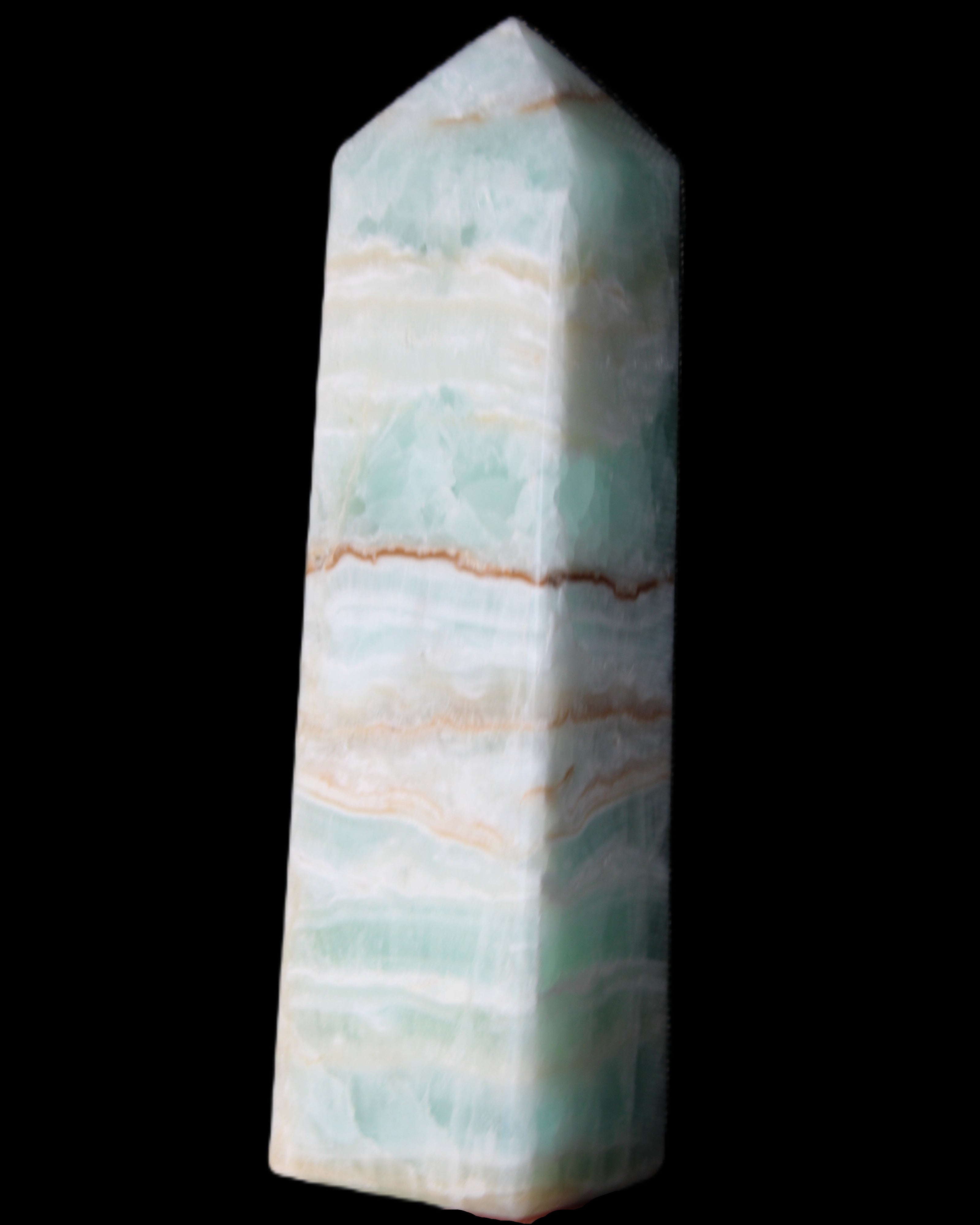 Pistachio Calcite obelisk 134mm 346g in sunlight - Rocks and Things Store