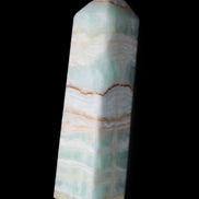 Pistachio Calcite obelisk 134mm 346g in sunlight - Rocks and Things Store